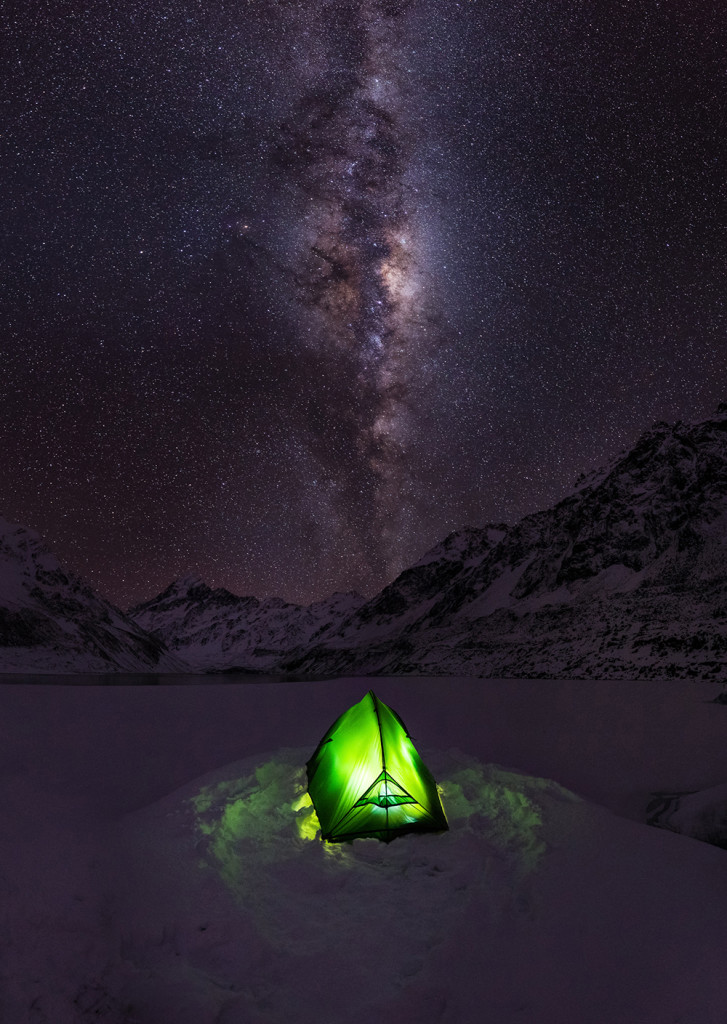 "After a large winter storm blanketed the South Island of New Zealand with snow, many of the high country roads in Central Otago were impassable. I was stuck in Mount Cook Village for a few days, so I hiked into the Hooker Valley and made camp on a frozen iceberg in the middle of Hooker Lake. I spent the night here and took photos of the Milky Way arching over my tent, Mount Cook, and the surrounding Southern Alps on one of the coldest and clearest nights of my life. Mount Cook is New Zealand's tallest mountain. "