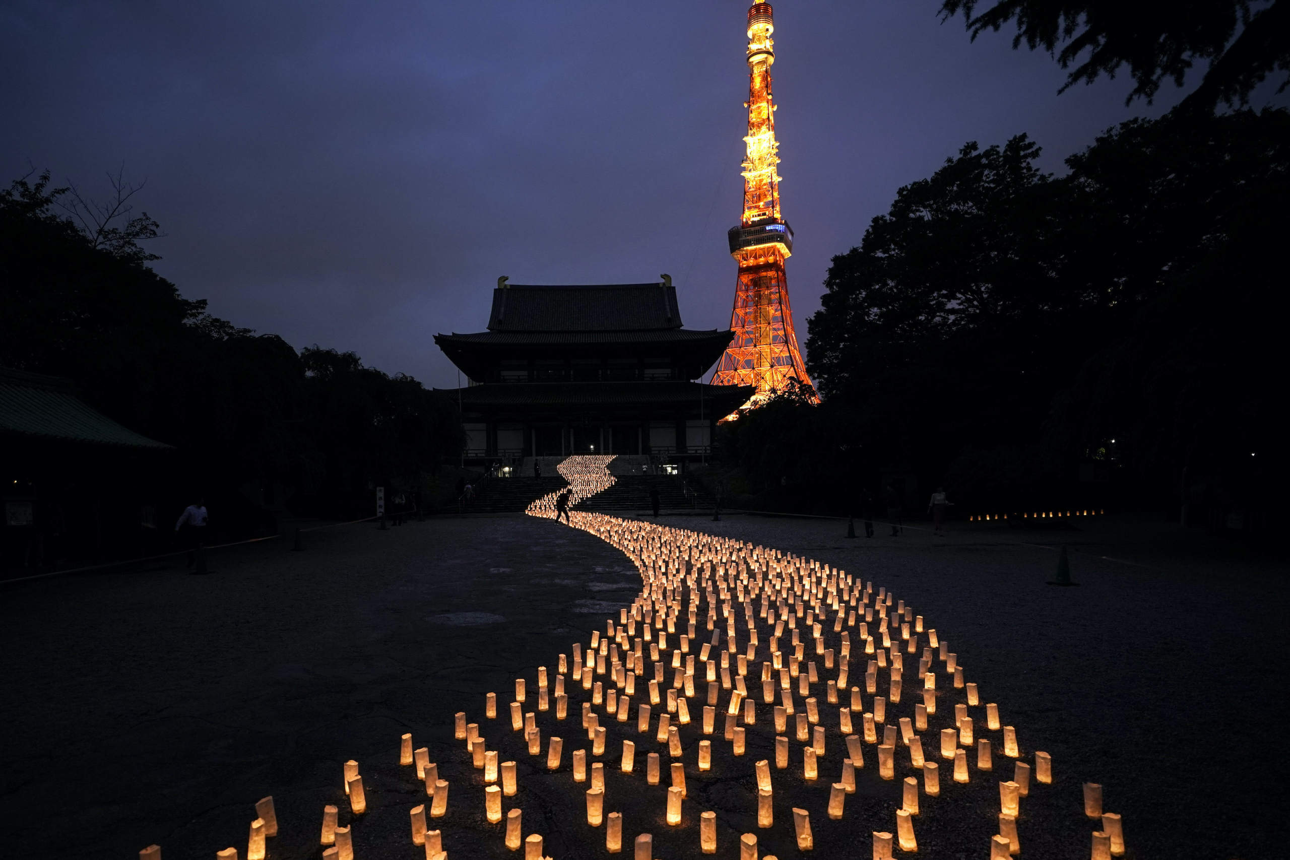 In this photo shot on Sony equipment, thousands of candles are arranged in the shape of the Milky Way to celebrate Tanabata, a Japanese star festival, at Zojoji Temple, July 5, 2019, in Tokyo. (AP Photo/Jae C. Hong)